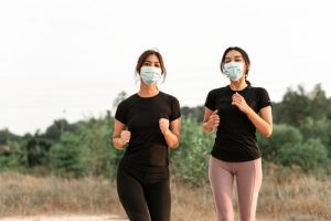 Beautiful,Asian,Teenagers,Doing,Exercise,While,Wearing,Face,Mask